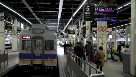 Commuters-Making-Their-Way-To-Local-Train-At-Namba-Station-Platform-Number-5