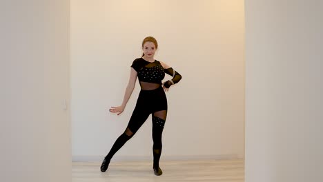 Modern-young-female-dance-performer-teaching-an-online-dance-class-from-home-slow-motion
