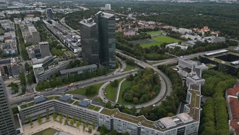 Munich-city-transport-infrastructure,-vehicles-on-the-move-at-business-zone