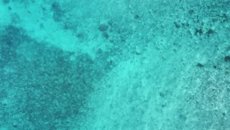 Flyover-shallow-turquoise-lagoon-water:-A-copy-space-moving-background
