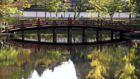 View-Of-Hasuike-Bridge-Over-Reflective-Pond-At-Koyasan