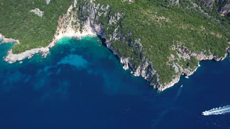 Mediterranean-Harmony-in-Albania:-Tourists-Admire-Deep-Blue-Seas-and-Verdant-Hills-on-the-Rocky-Shores-of-a-Coastal-Gem