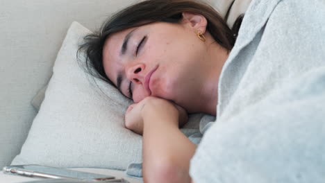 Siesta-time:-Close-Up-of-Young-Woman-Sleeping-Soundly-on-Couch