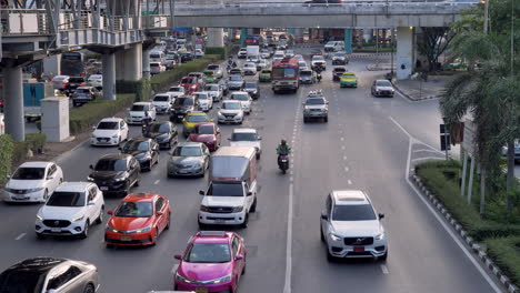 Daily-traffic-scenario-in-Bangkok-revealing-all-kinds-of-vehicles,-private-and-public-transports-plus-motorcycle-taxis-and-delivery,-Bangkok,-Thailand