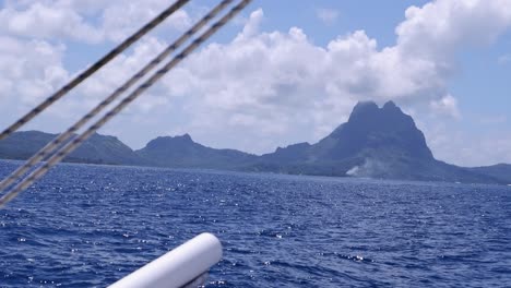 View-from-sailboat:-Small-mountainous-island-of-Bora-Bora,-Polynesia