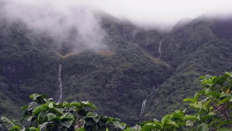 Pan-across-low-cloud-jungle-mountain-waterfalls-in-French-Polynesia