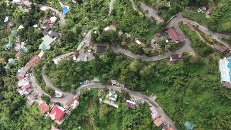 High-aerial-view-over-winding-mountain-roads-of-Cebu-City