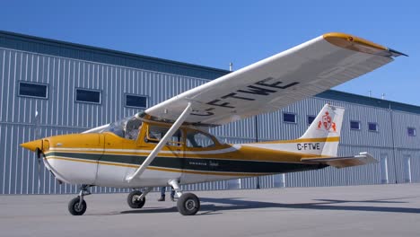 Cessna-C172-Skyhawk-Airplane-in-Front-of-Hangar---Sunny-Day,-Low-Angle