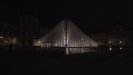 Louvre-Pyramid-is-in-the-main-courtyard-of-the-Louvre-Palace-in-Paris,-surrounded-by-three-smaller-pyramids