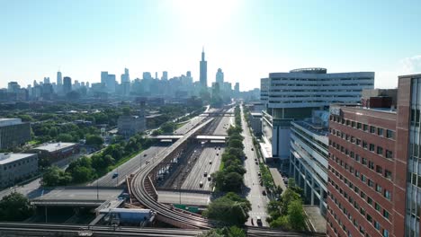 Chicago-skyline-view-with-train-tracks-and-Rush-University-Medical-Center-hospital