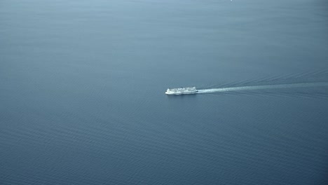 Aerial-View-Of-Luxury-Cruise-Ship-Sailing-In-The-Fjord-With-Calm-Waters