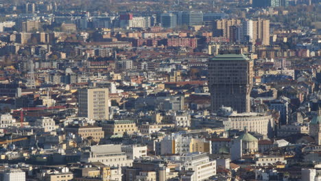 Torre-Velasca-tower-built-in-1950s-in-Milan-city,-aerial-panoramic-view