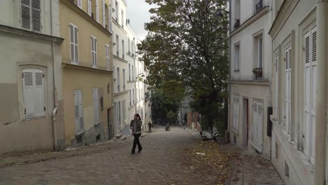 Perched-on-the-top-of-a-small-hill-in-the-18th-arrondissement,-the-most-famous-Parisian-Montmartre-district-has-lost-none-of-its-village-atmosphere