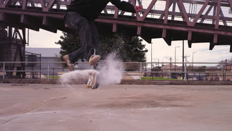 Skateboarder-in-Super-Slow-Motion-360-Flip-with-Powder
