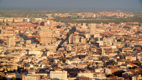 Torre-Velasca-in-Milan-during-sunset,-aerial-drone-view