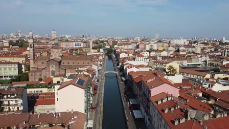 Water-canal-and-beautiful-rooftops-of-Milan,-Navigli-district,-aerial-view