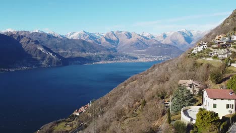 Panoramic-view-of-lake-Como-and-Alps-with-private-estates,-aerial-view