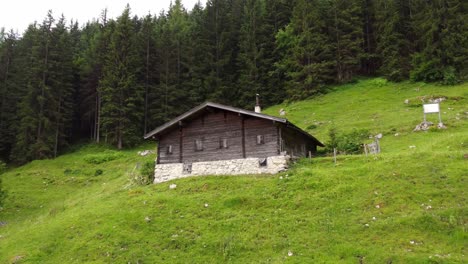 Old-Wooden-Cottage-In-The-Austria-Alps---Drone-Footage