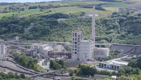 Hope-cement-works-establishing-aerial-view-overlooking-industrial-factory-in-idyllic-Derbyshire-Peak-district-valley