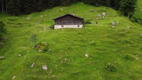 Aerial-Fly-By-Of-An-Alpine-Farmhouse-In-Austria-Stock-Almhütte-Lofer