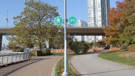 Vancouver,-Canada---An-Urban-Panorama-Featuring-a-Sidewalk,-Bicycle-Lane,-Structure,-and-Elevated-Roadway---Static-Shot