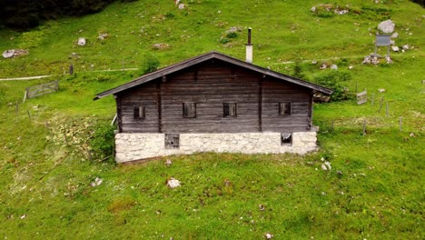 Old-Wooden-Cottage-In-The-Austria-Alps---Drone-Footage