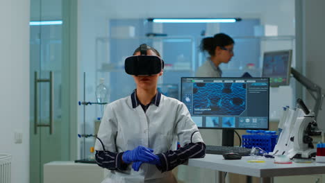 Laboratory-doctor-experiencing-virtual-reality-using-vr-goggles