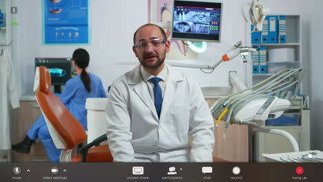Man-stomatologist-speaking-on-video-camera