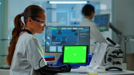 Medical-research-scientist-working-on-tablet-with-green-screen