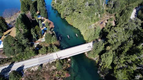 Vehicle-driving-on-bridge-beautiful-remote-landscape-of-Argentina,-aerial-view