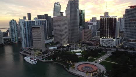 Slow-Aerial-Rotation-Over-Bayfront-Park-Downtown-Miami-Revealing-The-Beautiful-Sunset-City-Skyline