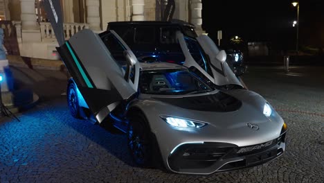 Futuristic-project-one-Mercedes-car-with-open-scissor-doors-during-night