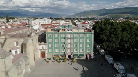 Building-next-to-the-cathedral-of-Oaxaca,-green,-in-the-historic-center