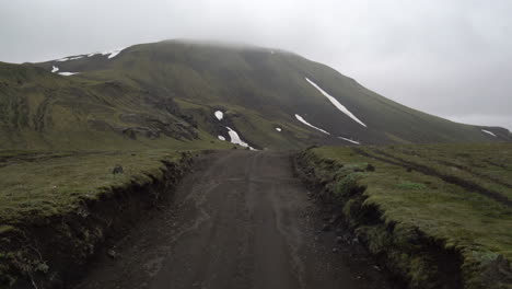 Off-road-car-vehicle-drive-on-dirt-road-to-Landmanalaugar-on-highlands-Iceland.