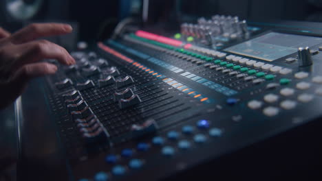 Sound-Engineer-Uses-Audio-Mixer-in-Recording-Studio