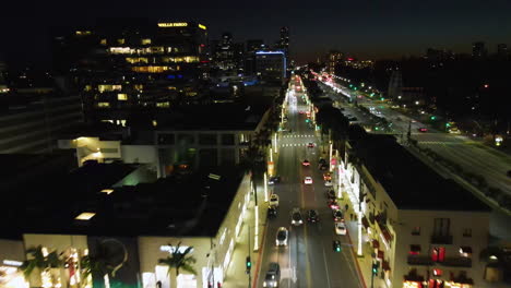 Aerial-view-over-traffic-on-the-illuminated-streets-of-Beverly-Hills,-night-in-LA