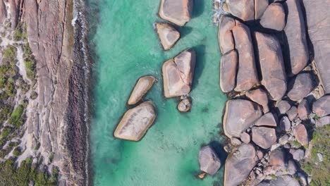 Top-down-drone-view-of-Elephant-Rocks-as-water-flows-past-the-boulders