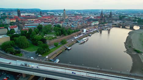 Panoramic-aerial-view-of-Dresden-city-on-the-River-Elbe-at-sunset,-Augustus-bridge,-Saxony,-Germany