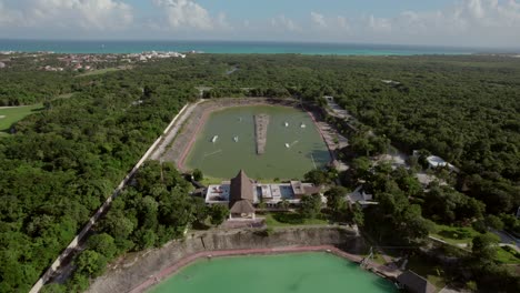 Aerial-view-over-Playa-del-Carmen,-Mexico,-mesmerizing-Mayan-Water-Complex