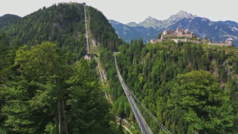 Spectacular-aerial-view-of-the-suspension-bridge-leading-to-Ehrenberg-Castle-in-Tyrol,-Austria