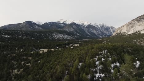 Drone-retreating-from-Mount-Antero-in-the-Rocky-Mountains-in-Colorado-over-pine-trees-during-sunrise