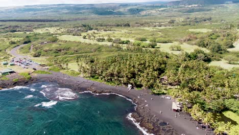 Aerial-over-coast-of-Big-Island,-Hawaii-at-Punaluʻu-Beach,-United-State
