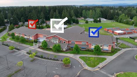 Aerial-view-of-a-school-with-voting-checkmarks-appearing-overhead