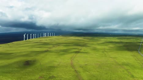 Aerial-of-wind-turbine-green-energy-power-field-on-Big-Island,-Hawaii-USA