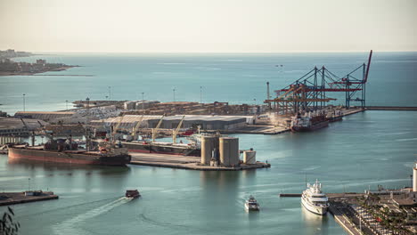 Malaga,-Spain-harbour-cargo-port-time-lapse-ship-leaving-port-during-day