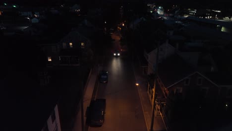 Car-driving-on-dark-city-alley-street
