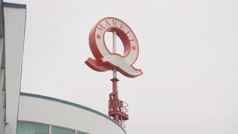 A-large,-slow-spinning-Q-shaped-Hotel-sign-atop-a-building