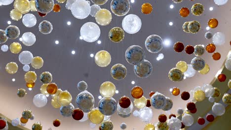 A-ceiling-decorated-by-colorful-glass-balls-in-a-large-hotel-in-El-Alamein,-Egypt-low-angle-shot