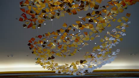 A-ceiling-decorated-by-colorful-glass-and-white-LED-strip-in-a-large-hotel-in-El-Alamein,-Egypt-low-angle-shot