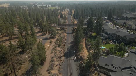 Drone-footage-of-train-tracks-in-Bend,-Oregon-on-a-sunny-day